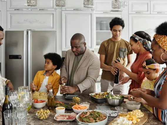 a large family cooking together