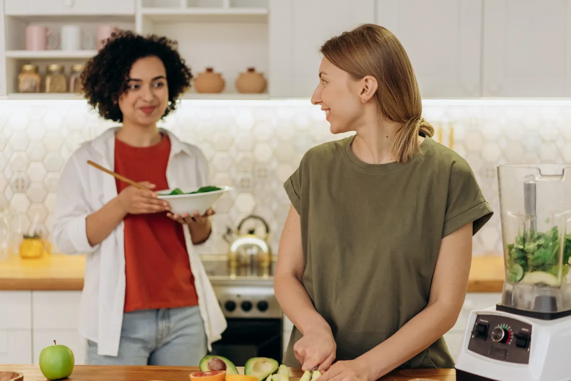 two people cooking